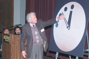 IMAGE:  Leon Lederman, the Frank L. Sulzberger professor emeritus in physics and the College, advances the minute hand on the "Doomsday Clcok."