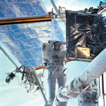 IMAGE:  John Grunsfeld, SM'84, PhD'88, repairs the crippled Hubble Space Telescope.