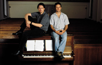 IMAGE:  Mark Hollmann (left) and Greg Kotis share a perch in the church where their show got its start.