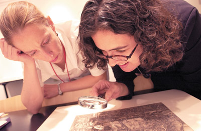 IMAGE:  Worth the wall space?  Curators Elizabeth Rodini (left) and Rebecca Zorach debate including a Durer print in an upcoming show.