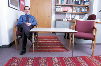 IMAGE:  Daniel le Grange sits at the picnic table for anorexic girls' families, whose mealtime habits he scrutinizes.