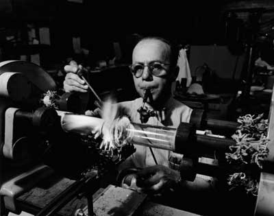 IMAGE:  Glass blower Christian Van Hesper, superintendent of the U of C glass shop, shown December 21, 1955. Part of the physical-sciences division, the shop closed in the early 1980s.