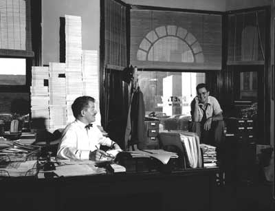 IMAGE:  Harold Donohue, PhB'46, and editor Karl Shapiro (above) in the offices of Poetry: A Magazine of Verse, August 14, 1952, during the magazine's 40th anniversary year.