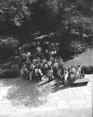 IMAGE:  As incoming first-years learned the tradition of the C-bench during Orientation Week, September 20, 1954, Lewellyn snapped this photo from a window in Cobb. "It was a window in a staircase," he says, "and I shot between the window frame."