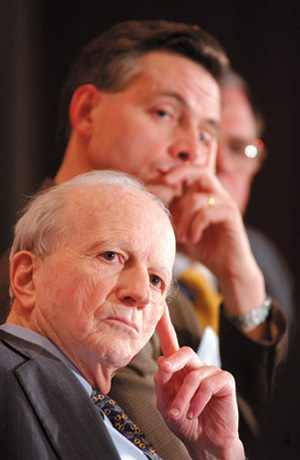 PHOTO:  Panelists Gary Becker and Robert Wright see dangers ahead for the global economy.