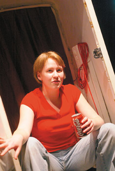 IMAGE:  Diabetic Kay Perdue drinks carb-rich Coca-Cola during her one-woman show, which a Summer Arts Fellowship freed her to write.