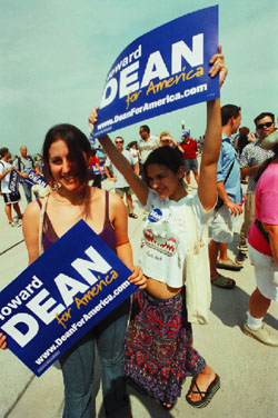 IMAGE: Danielle Hubbard and Burcu Yavuz, both '05, sport Howard Dean signs at a rally for the Democratic candidate.