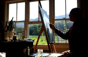 IMAGE:  Country life: Langrock painting in his home studio.