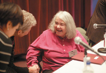 IMAGE:  Kate Millett greets a fan after her panel.
