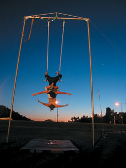 PHOTO:  The Midway twirls with trapeze artists.