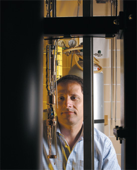 image: Thomas Rosenbaum checks a freezer that cools samples to not-quite absolute zero.