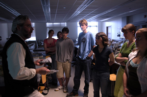 photo:  Neil Shubin brings a plaster cast of a news-making fossil to a Chordate Evolutionary Biology lab; students who want to see the original, he says, can drop by his office.