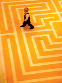 photo: Creative moves: A young visitor navigates a maze, part of the Hyde Park Art Center’s opening exhibition. 