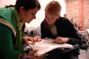 photo: International-studies major Yesenia Alvarez helps Alex Krysiak decipher the morning paper.