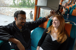 photo: Fourth-year Tameem Zainulbhai chats with Alex Krysiak as they wait for classmates to return to the tour bus.