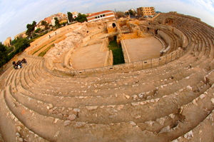 photo: On a day trip to Tarragona, the class perches in the ruins of a seaside amphitheater built when the city was a Roman outpost—later the amphitheater was home to a church and a stone quarry.