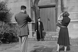 IMAGE: A graduate poses for photographs