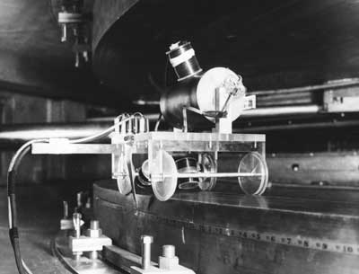 IMAGE:  This lucite trolley car, designed and built by Enrico Fermi, rotated around the synchrocyclotron, which sat 32 feet below the ground floor of the Ellis Avenue Accelerator Building. Lewellyn photographed the trolley in 1952 because, he says, "I thought it was cute."