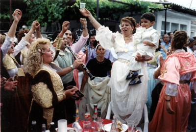 IMAGE:  Wedding celebrants in the Romani quarter of Skopje, Macedonia. Friedman first met Roms in the 1970s and is one of the few experts on their language and culture.