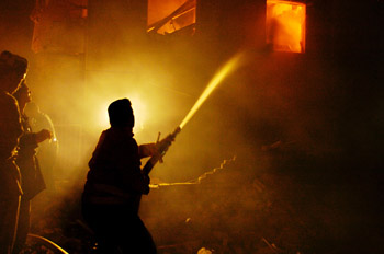 image:  U.S. and Iraqi soldiers fight a central Baghdad explosion.