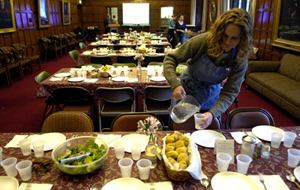photo:  Debra Erickson, a first-year PhD student in religious ethics, readies a lunch table.