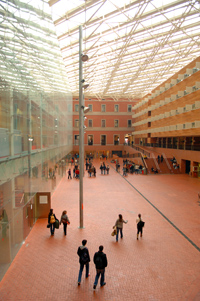 photo: An atrium at the Universitat Pompeu Fabra connects classrooms, cafeteria, offices, and a memorial to Catalan lecturers who lost their posts at the start of the Franco dictatorship.